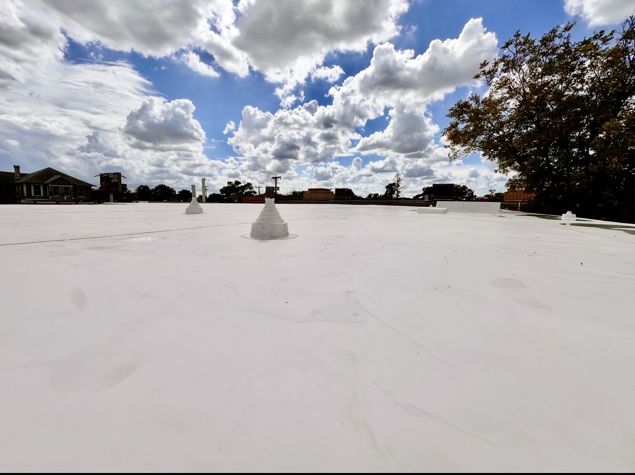 Completed white TPO commercial roof by Green Pro Roofing